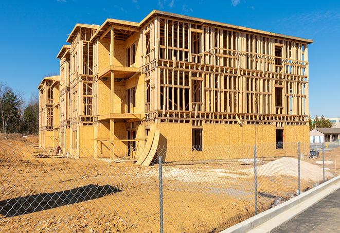 a snapshot of temporary chain link fences protecting a large construction project from unauthorized access in Tice